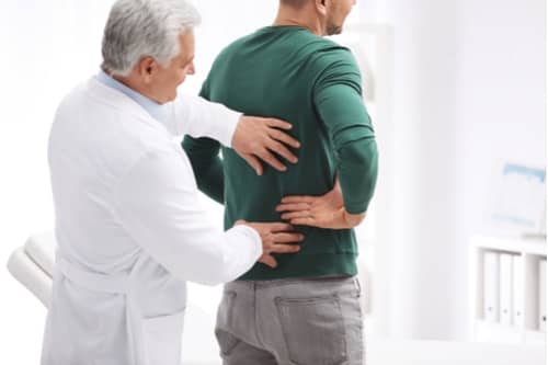 Fort Myers muscle strains treatment concept photo, chiropractor exam