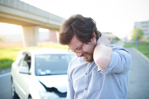 Neck pain from car wreck, concept of Sunrise whiplash treatment