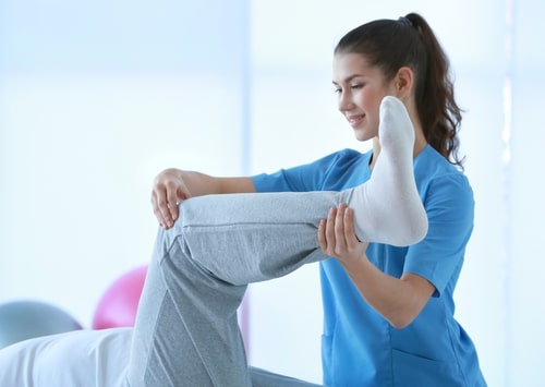 Sunrise Physiotherapy Services, Physical Therapist Helping Patient